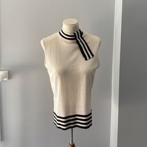 Carlisle sleeveless blouse in cream with ivory striped pattern, size M.